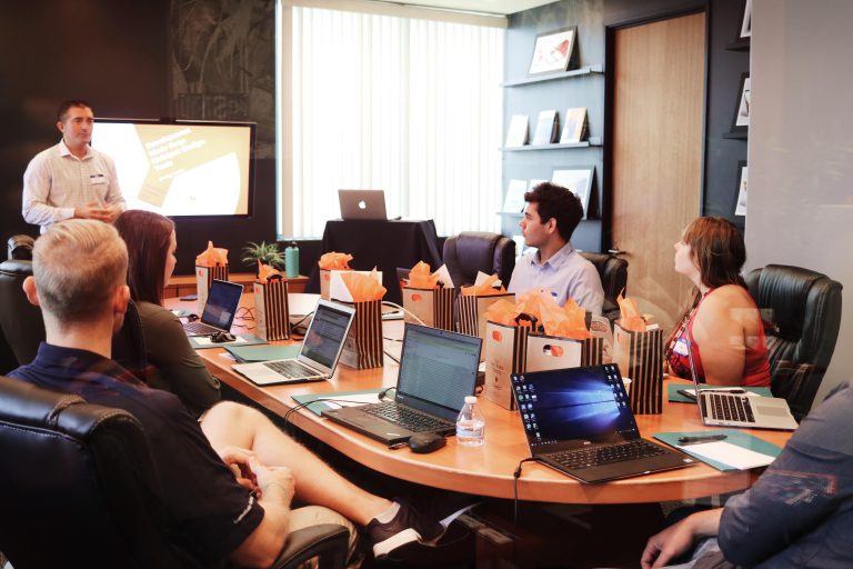 team discussing marketing intelligence report